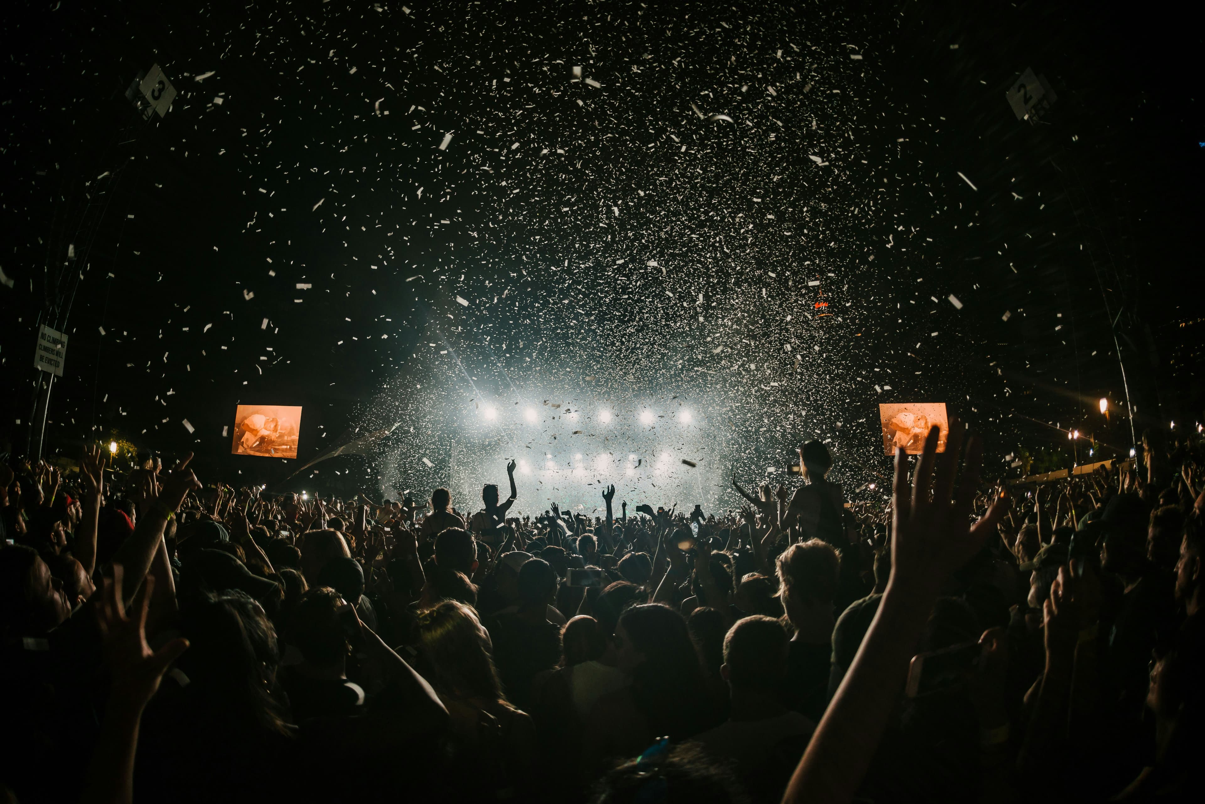 Creator at a vibrant live event with confetti